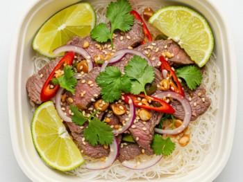 Thai Beef Salad With Coriander, Mint And Lime On Noodles With Sesame Soya Dressing